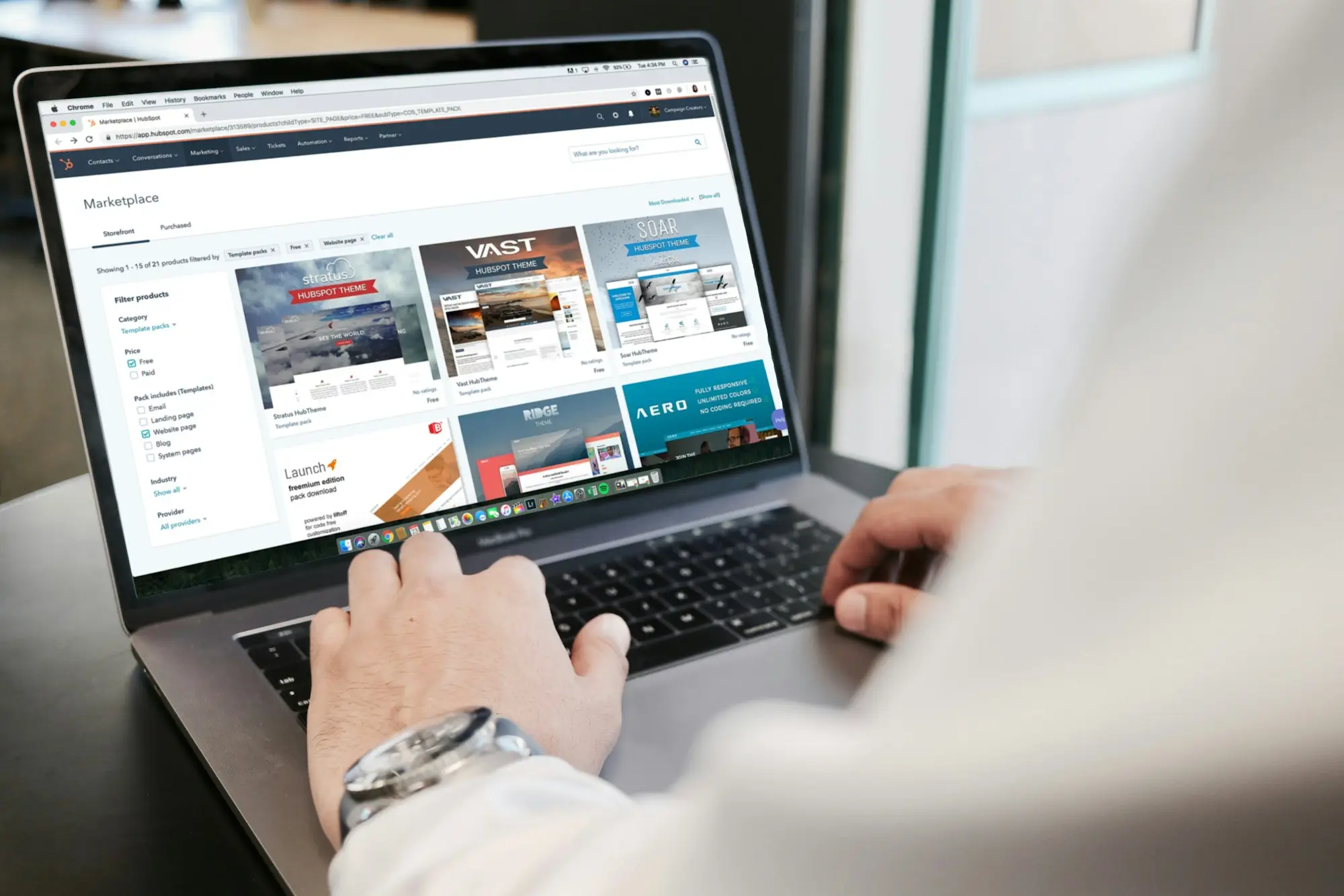 Bookkeeper checking an invoice on a laptop