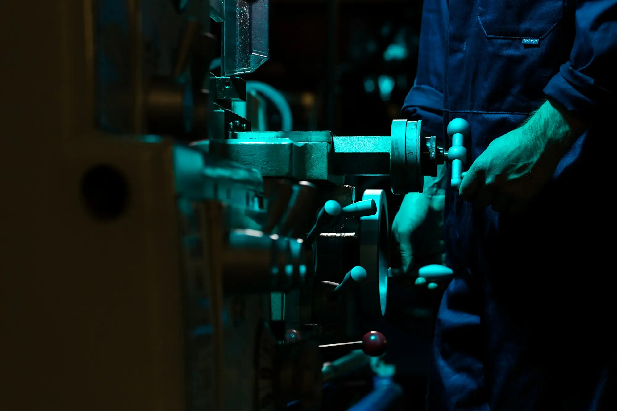 Technician repairing machinery in a workshop