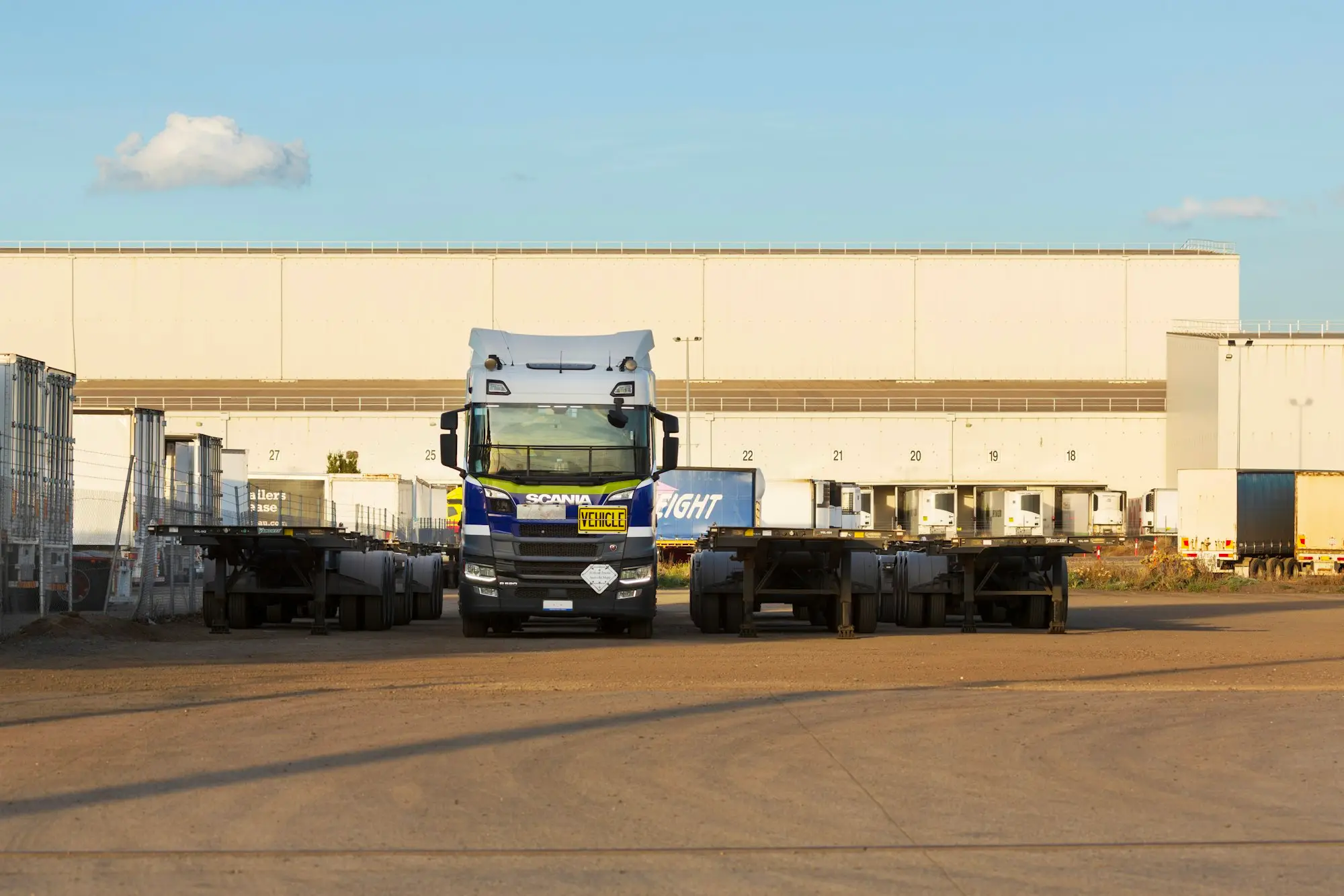Trucks lined up at a warehouse loading dock in Altona, Victoria