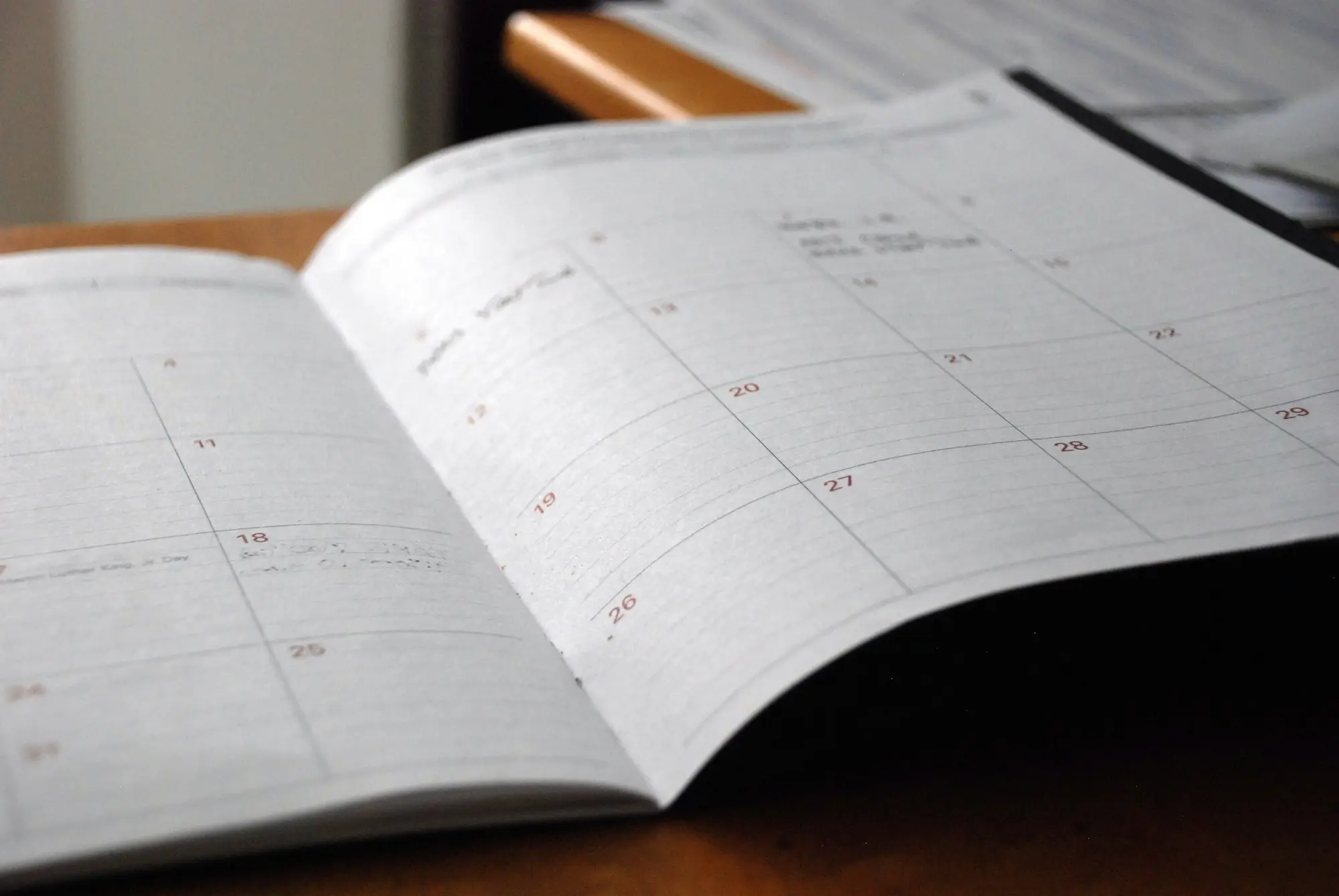 Open desk planner showing the week ahead
